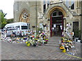 Flowers and candles outside Notting Hill Methodist Church