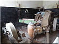 SK3622 : Calke Abbey - roomful of abandoned agricultural machinery by Chris Allen