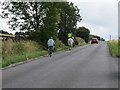 Three modes of transport (Bike, Horse and Automobile) ascending Yorkgate near Otley