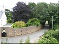 Road at Ayshford and wall of Ayshford House