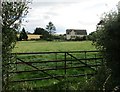 Grass field and houses near Birdlip