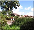 Houses above the railway line skirting Brundall