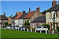 NT8947 : Houses overlooking the green at Norham by David Martin