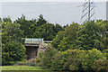 An M53 motorway bridge over a railway viewed from Landican Lane