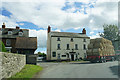 Bales passing the village pub