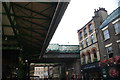 View of the railway bridge on Stoney Street from the entrance to Borough Market