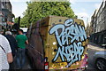 View of a graffitied van parked at the junction of Hackney Road and Columbia Road