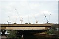 View of a plethora of cranes in Fish Island from the Hertford Union Canal towpath