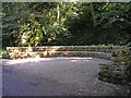 SD9952 : Stone seat in Skipton Woods by John Illingworth