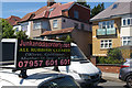 Houses and advertisement on Finchley Lane, Hendon