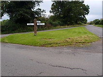 SP8685 : Road junction and grass triangle by Michael Trolove