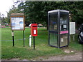 Elizabeth II postbox and telephone box on The Street, Ringland