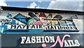 View of street art above Fashion Nails (originally the Mayfair Stationers) on Barkingside High Street