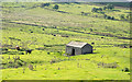 Barn in area of rough grazing