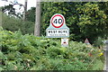 TF7714 : West Acre Village name sign on River Road by Geographer