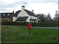 Elizabeth II postbox and the former Red Cow public house, Willslock