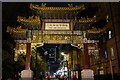 SJ8497 : Chinatown arch by night by Bob Harvey
