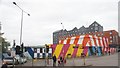 View of the brightly coloured former The Tryst pub building from outside Blackhorse Road station