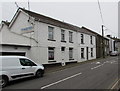 White houses and white van, Penrhiwfer Road, Penrhiwfer