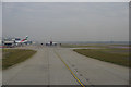 TQ0675 : Taxiway alongside 27L runway at Heathrow by Ian S