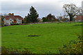 View across field with Cromhall church tower in the distance