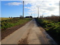 J2005 : View south-eastwards along a muddy section of Templetown Road by Eric Jones