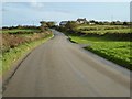 Country road approaching Rame Common