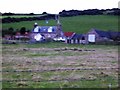NO8389 : Newbigging farm by Stanley Howe