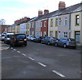 Row of houses and rows of cars, Rutland Street, Grangetown, Cardiff