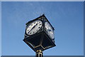 Looking up at the clock tower on the corner of Wood Street and Forest Road