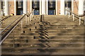 View of zigzag shadows of the handrails on the steps leading up into Waltham Forest College