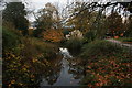 View of the moat circling Lloyd Park from the footbridge leading to the William Morris Gallery