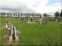 NZ2473 : Graves in Dudley Cemetery by Graham Robson