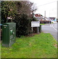 BT telecoms cabinet in Pentlepoir near the Wooden boundary sign, Pembrokeshire