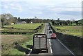 The A22 (Comber Road) south  of Toye