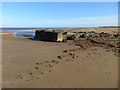 TF7545 : Ruins on Titchwell beach in Norfolk by Richard Humphrey