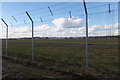 TL1220 : Perimeter fence at London Luton Airport by Geographer