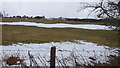 Snow drifts in pasture