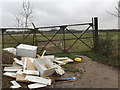 Fly-tipping in a field entrance by the B4087 south of Bishop?s Tachbrook