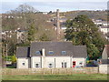 View past a house in Drumalane Road towards the chimney of the former Drumalane Mill