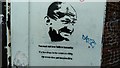 View of Mahatma Gandhi street art on the side of the opticians on Gale Street