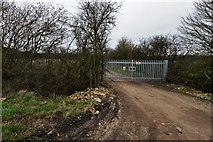 SP9758 : Felmersham: Gated track next to the sewage works by Michael Garlick