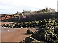 The eroded cliffs beneath The Blue Anchor Hotel