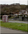 Dissimilar bus shelters alongside the A484 Pwll Road, Pwll, Carmarthenshire