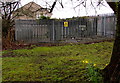 Western Power Distribution electricity substation at the edge of a churchyard, Beddau