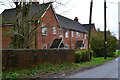 Modern housing by former railway bridge in Bridgetts Lane