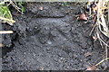 Benchmark on gatepost of field gate from Bingley Road