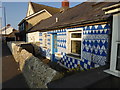 Gaily painted cottage on the High Street, Borth