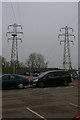 TM1242 : Pylon lines crossing superstore car-park, Copdock by Christopher Hilton