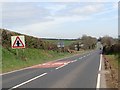 J3939 : Approaching the complex Moneycarragh Bridge Cross Roads on the A25 by Eric Jones